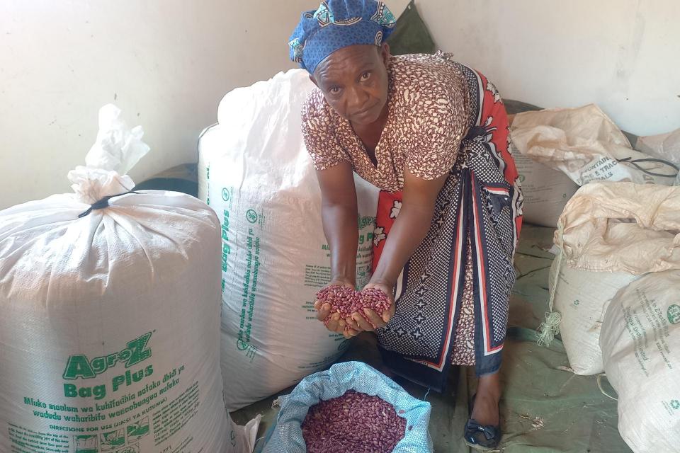 Eleanor Muli, of Makindu Ward, with her Nyota beans stored in hermitic bags