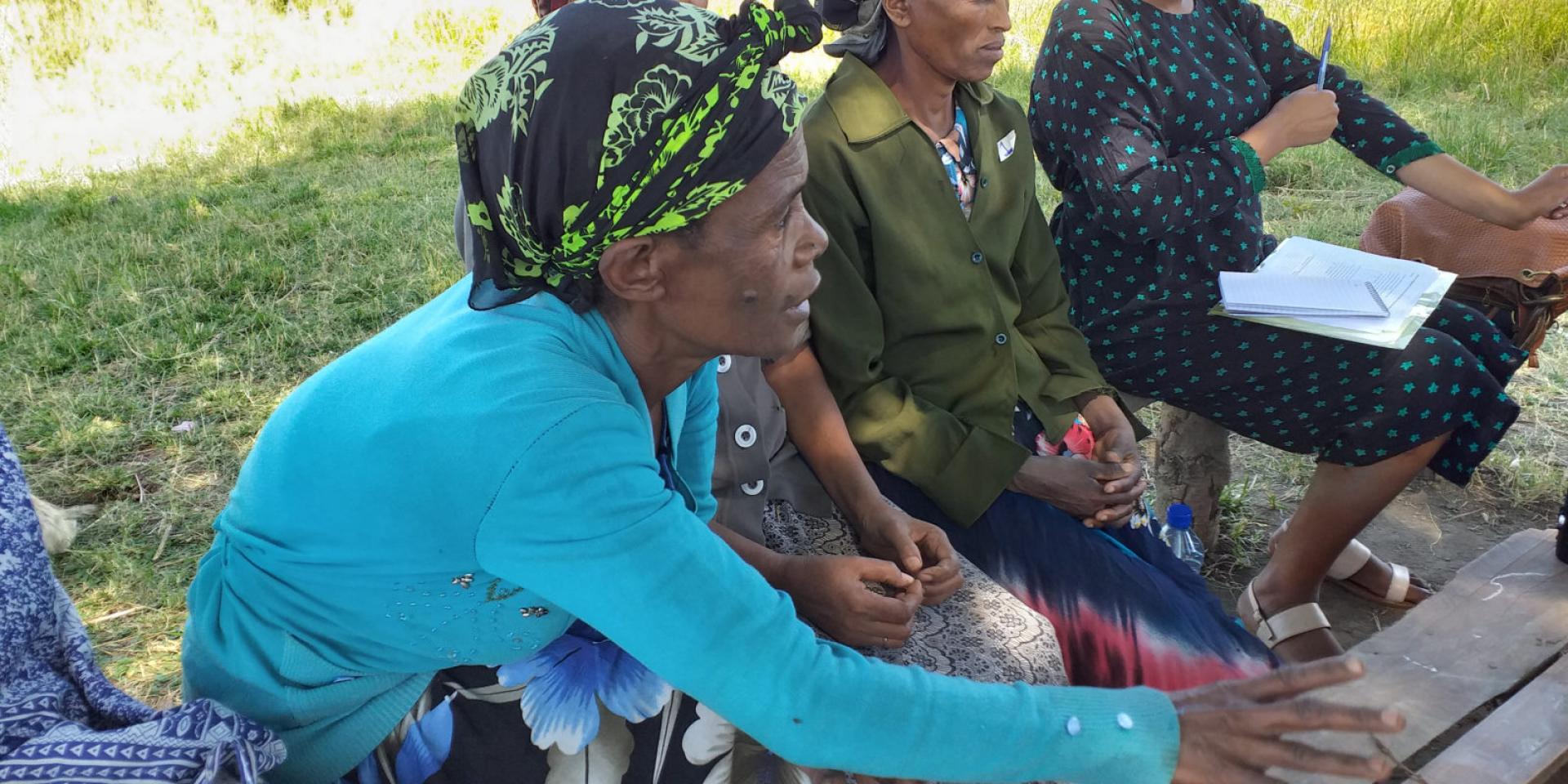 Women farmers explaining how they scout for the pest. Photo credit: Sarah Mayanja/CIP.