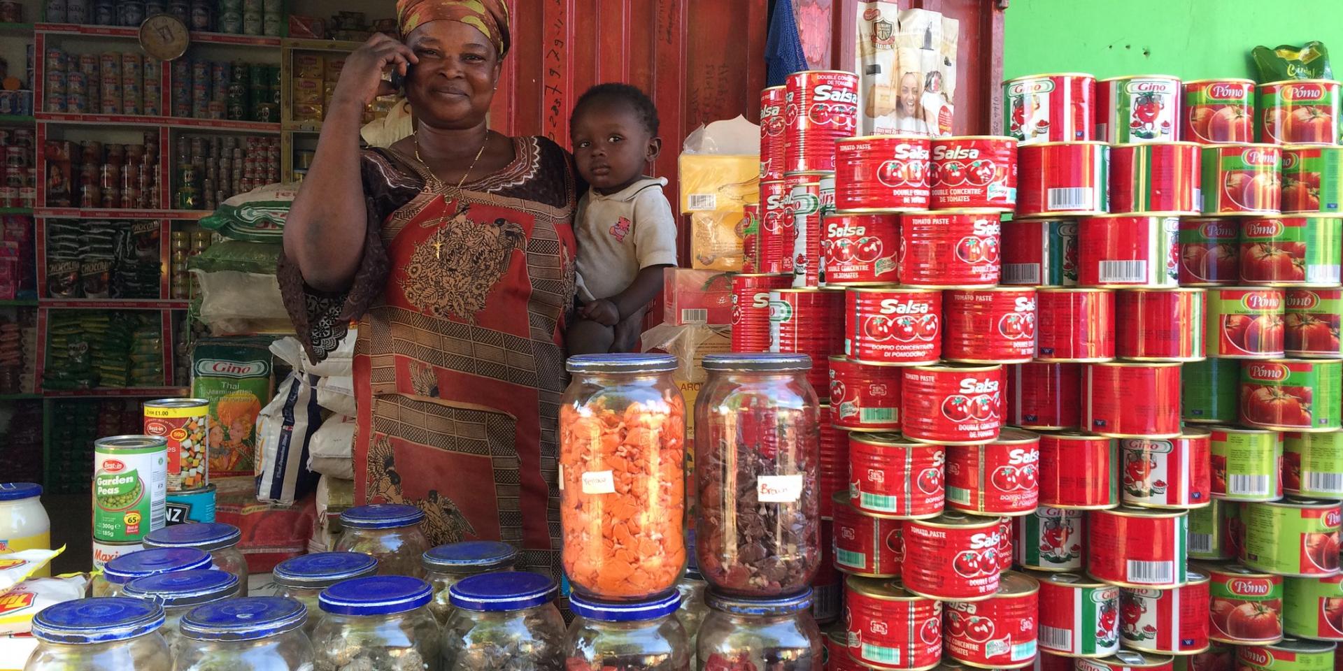 Woman on the phone in a store in Ghana