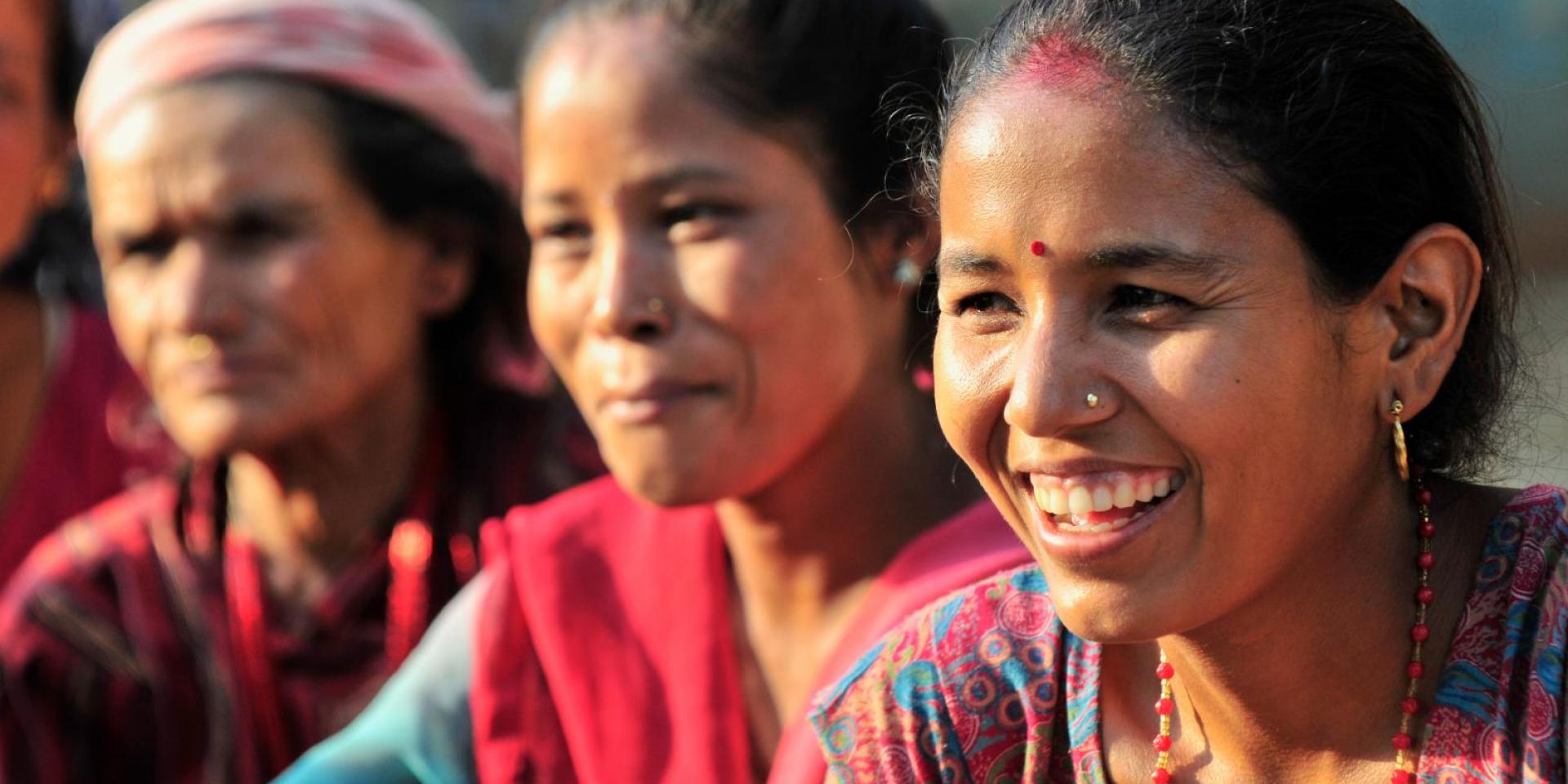 Women smiling in traditional Nepalese dress