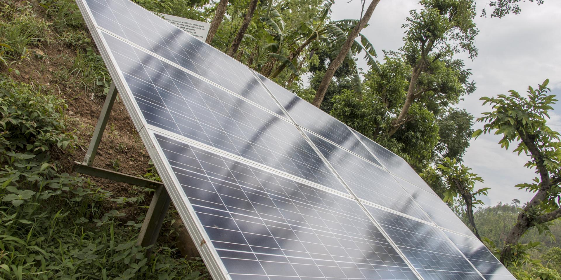 Solar panels power a water pump to bring irrigation water 68 meters from the river to the fields