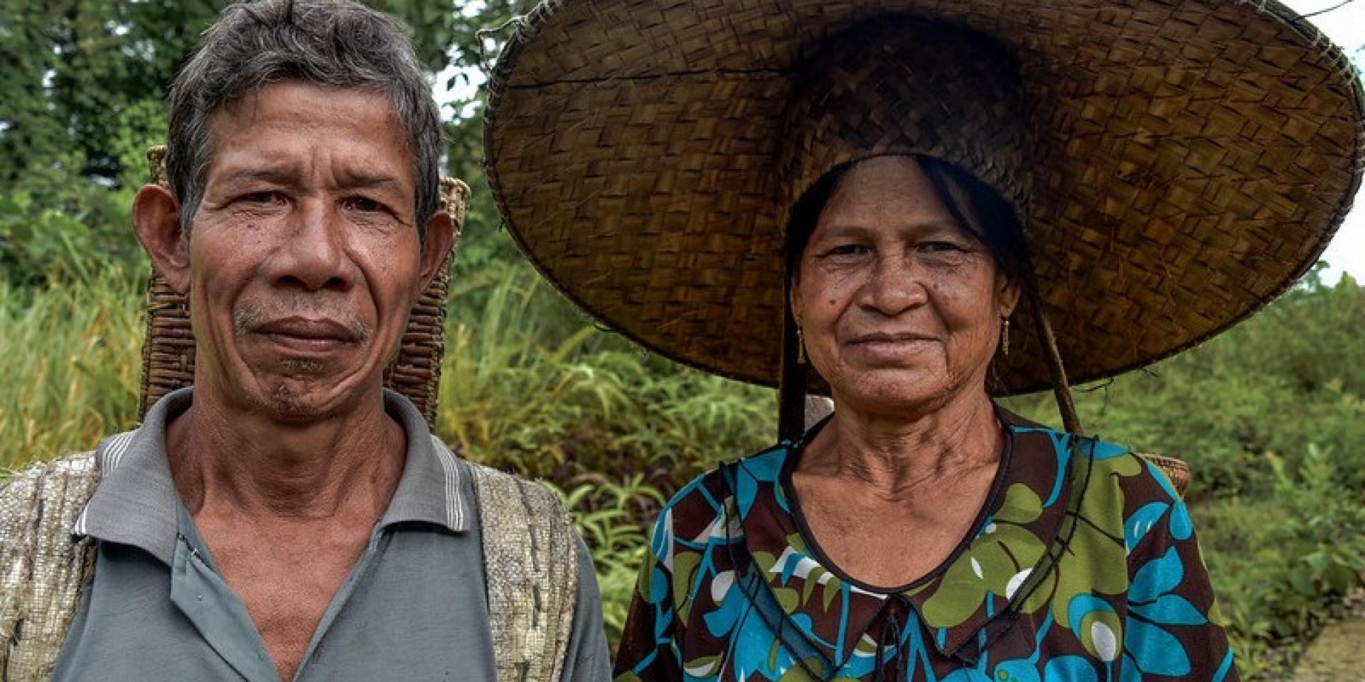 A man and a woman looking at the camera