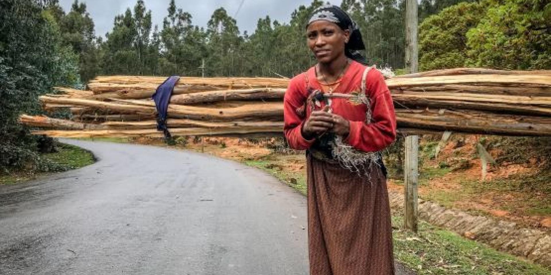 Woman carrying wood