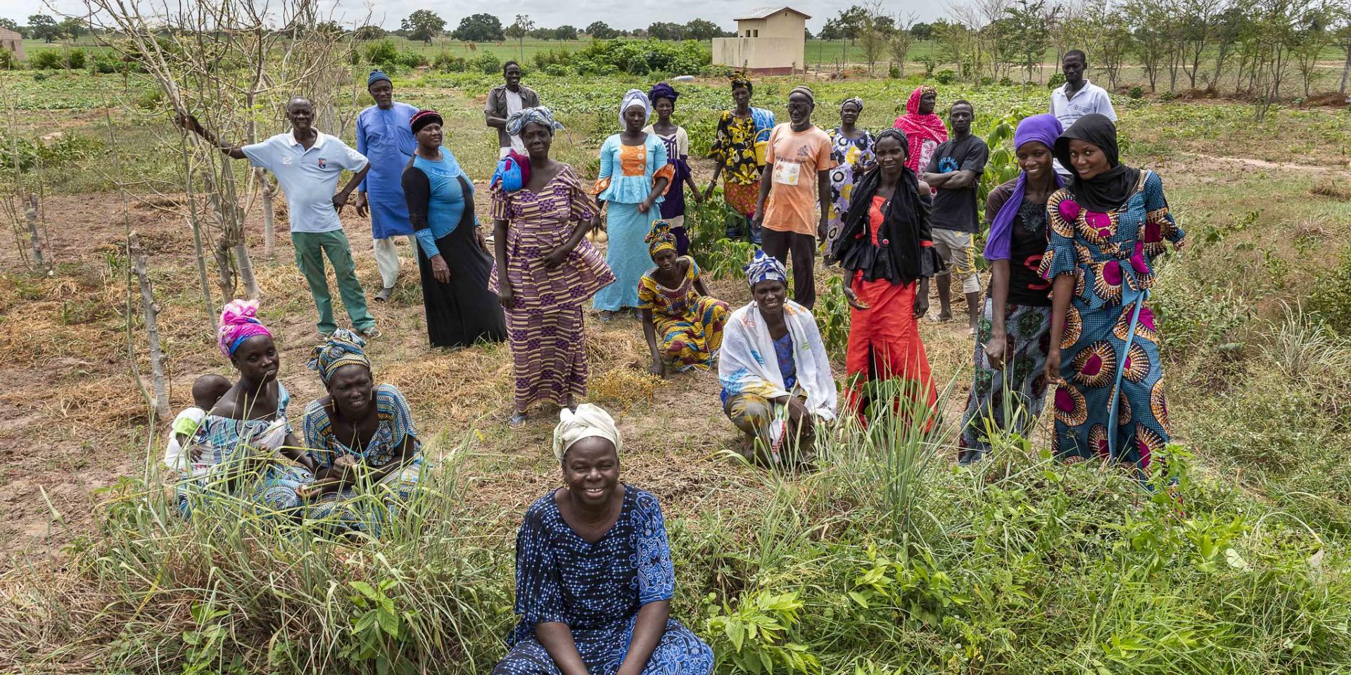 Farmers standing in field