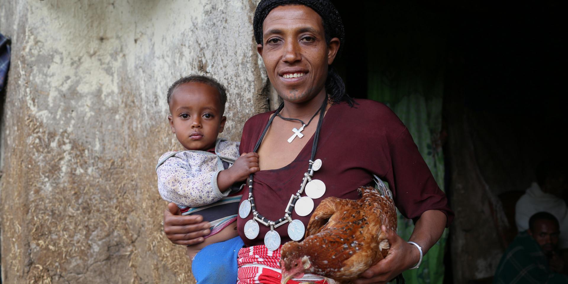 Teje Kassa, Agriculture to Nutrition (ATONU) project beneficiary with her son