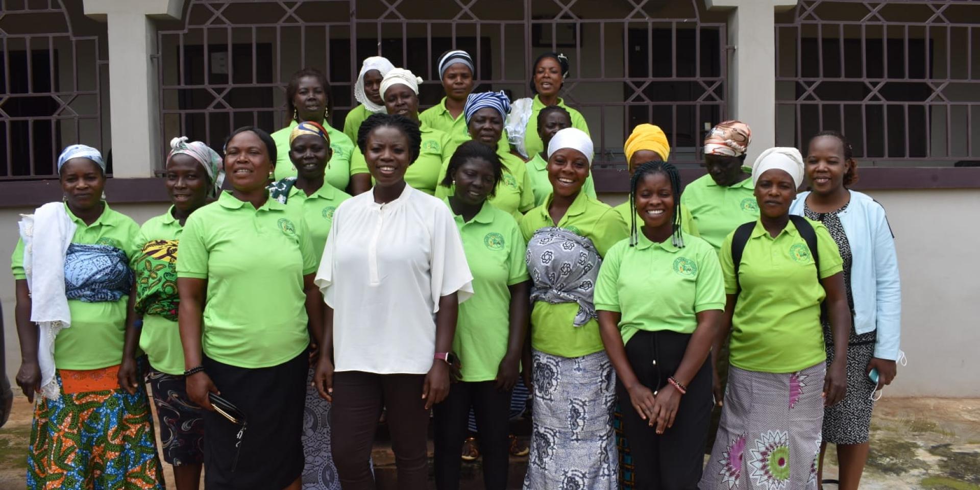 Edith Akosah Wheatland poses for a picture with farmers at Ankomado