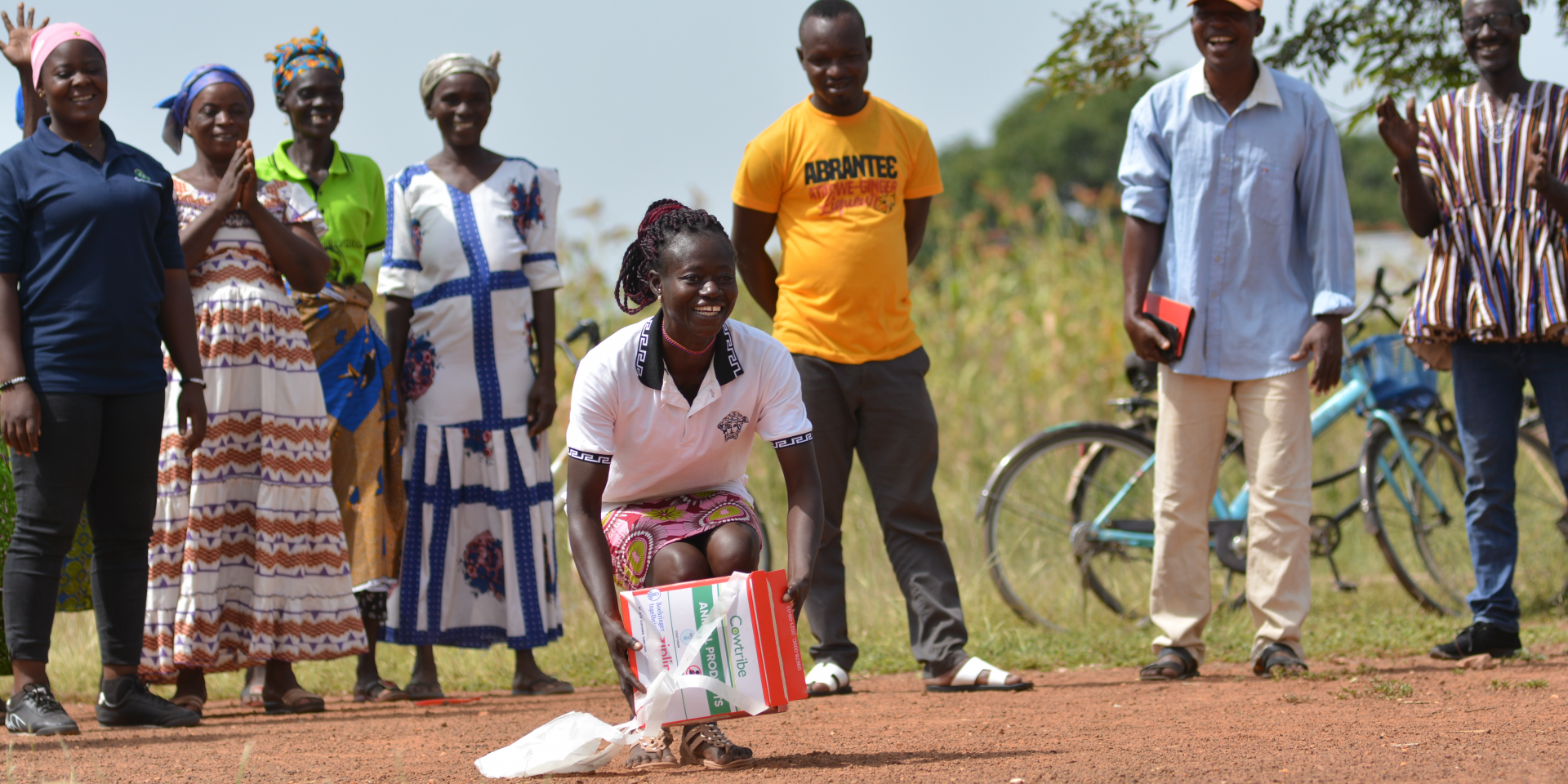 A woman receives a livestock vaccine via drone
