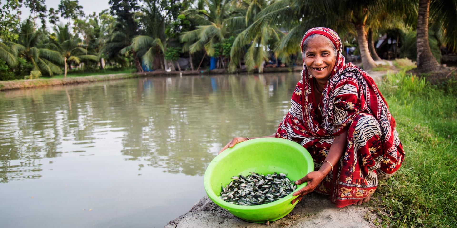 Woman with fish in Bangladesh