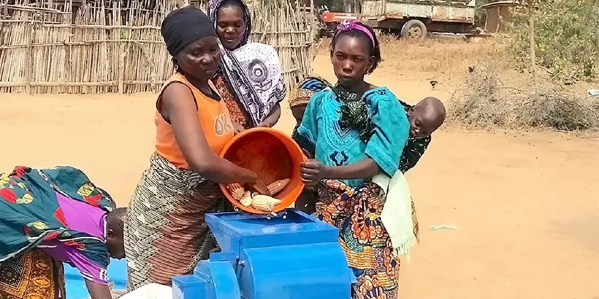 Rural women in Kongwa District, Tanzania, using a low-cost maize thresher run by a diesel engine. (Photo: C. Mutungi/IITA).