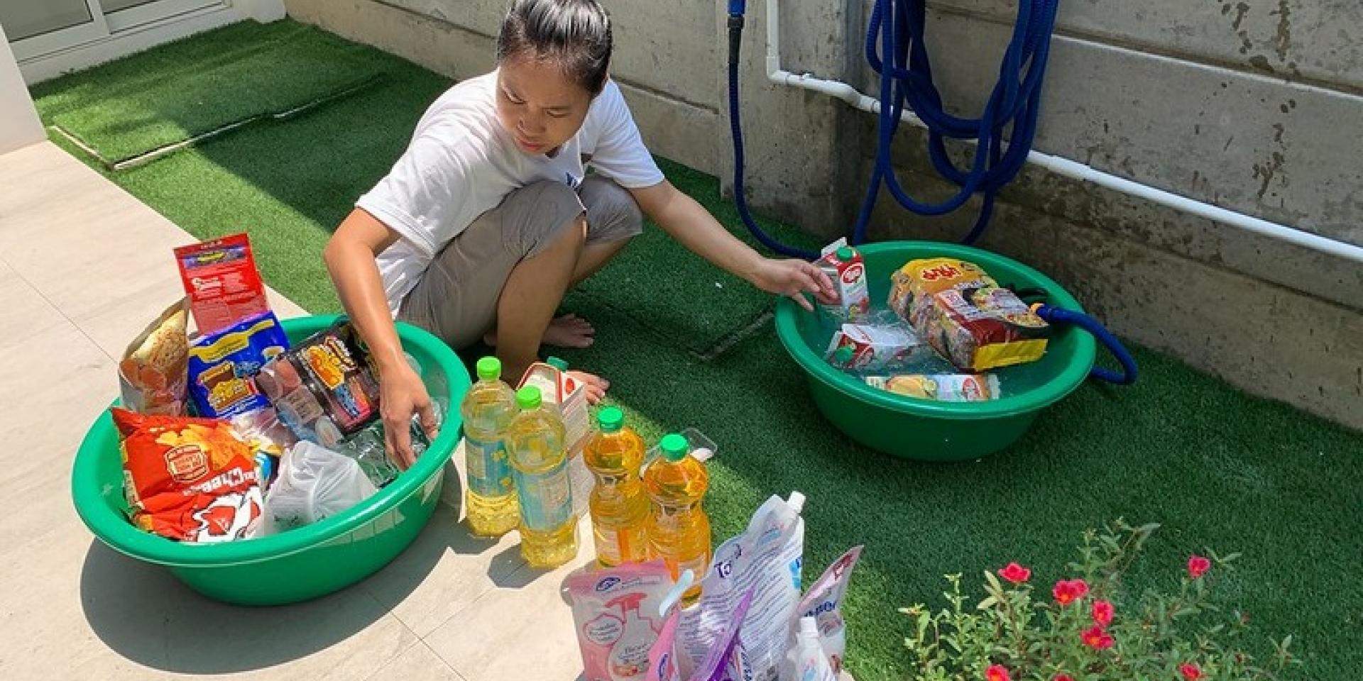 Woman cleaning her groceries