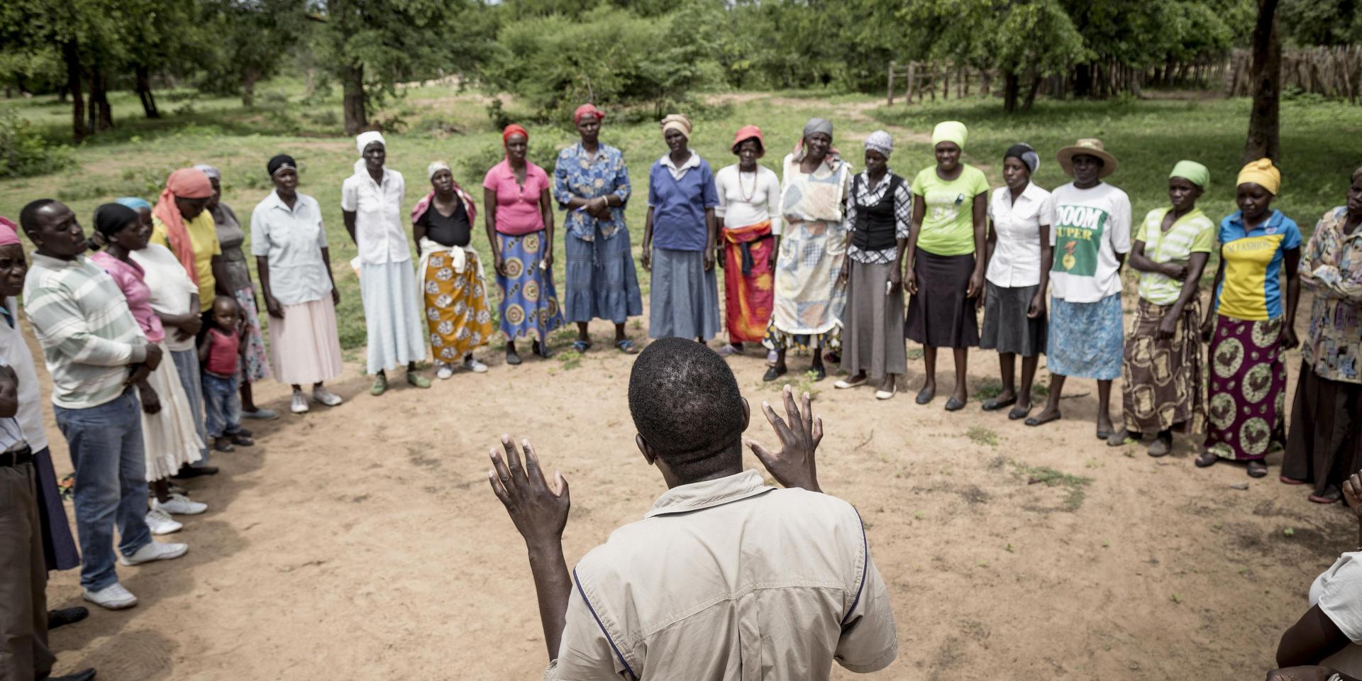 District field officer talks to a group of women