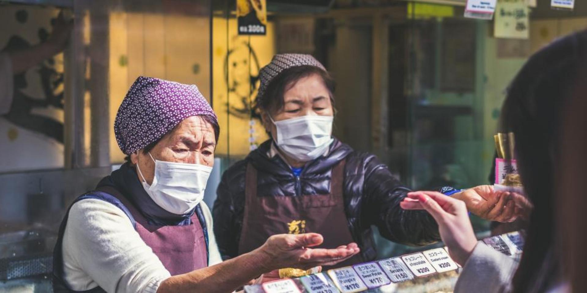 Asian women selling food