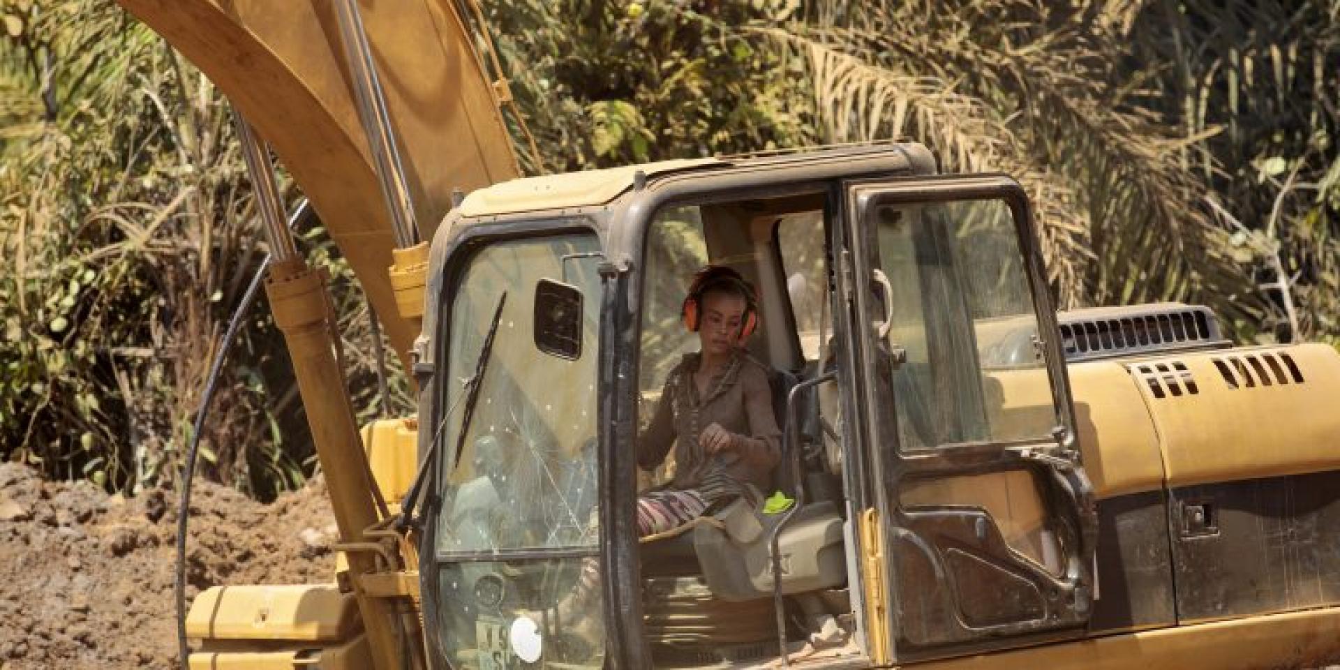 Woman driving an excavator