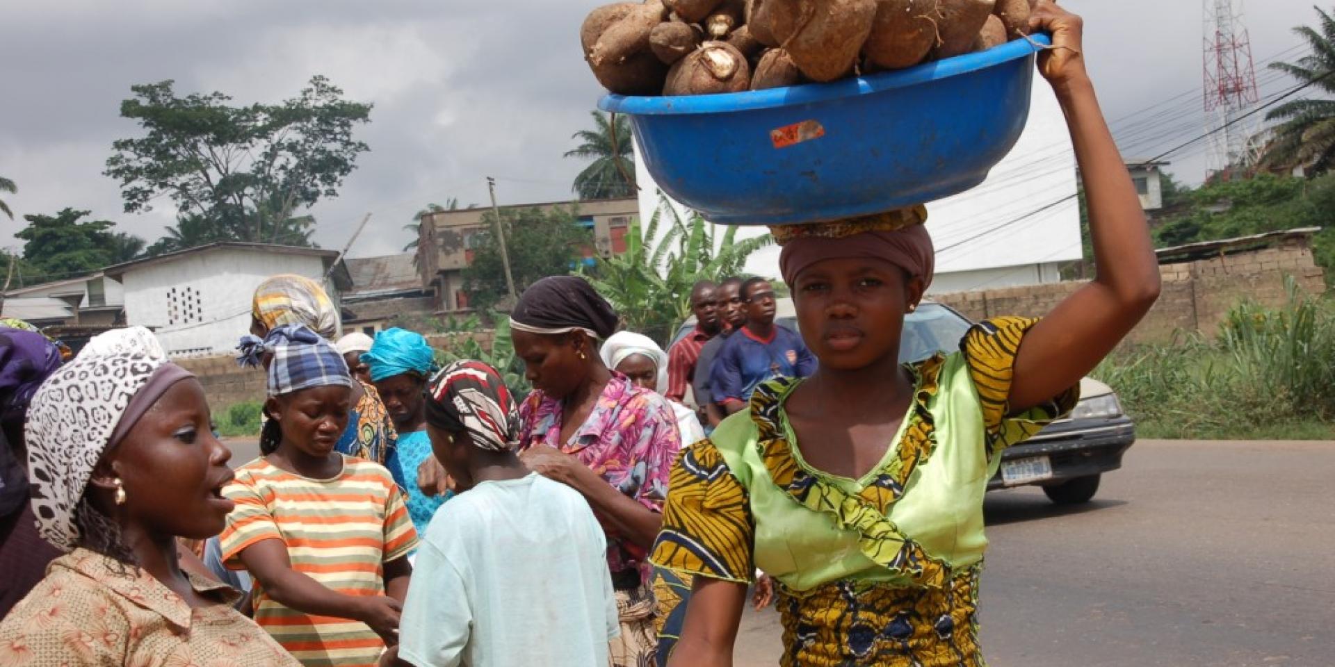 A woman carrying cassava