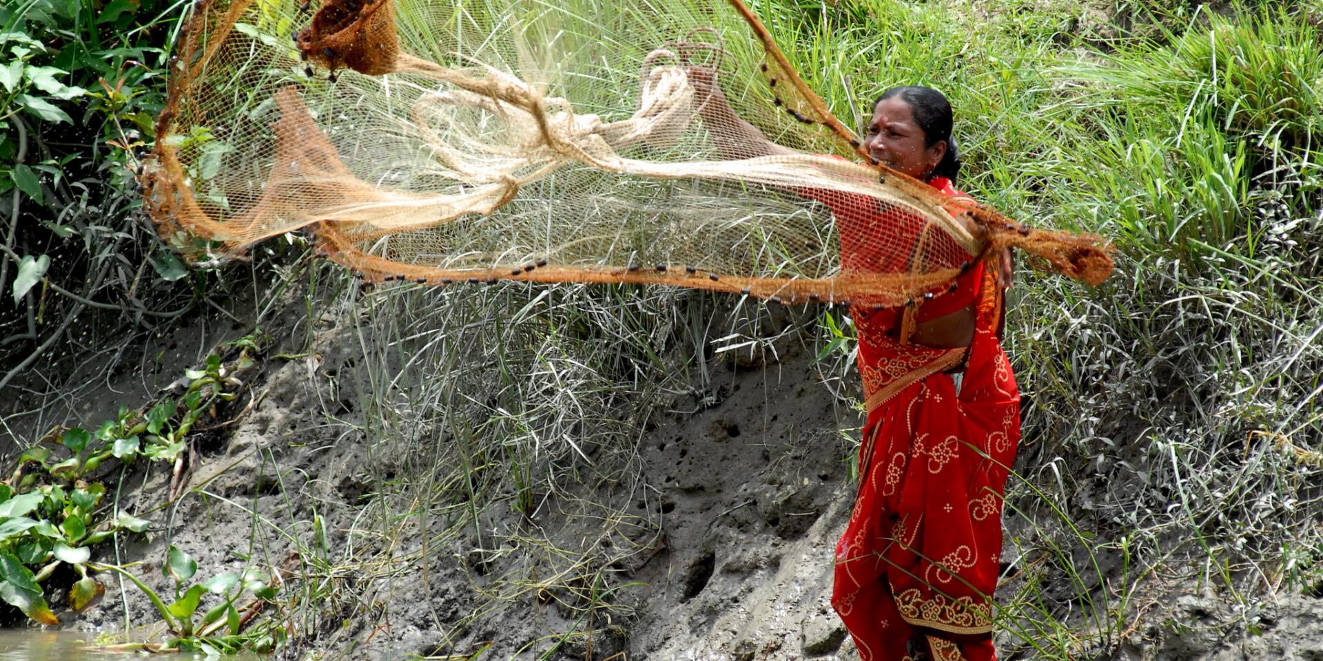 A woman setting a net