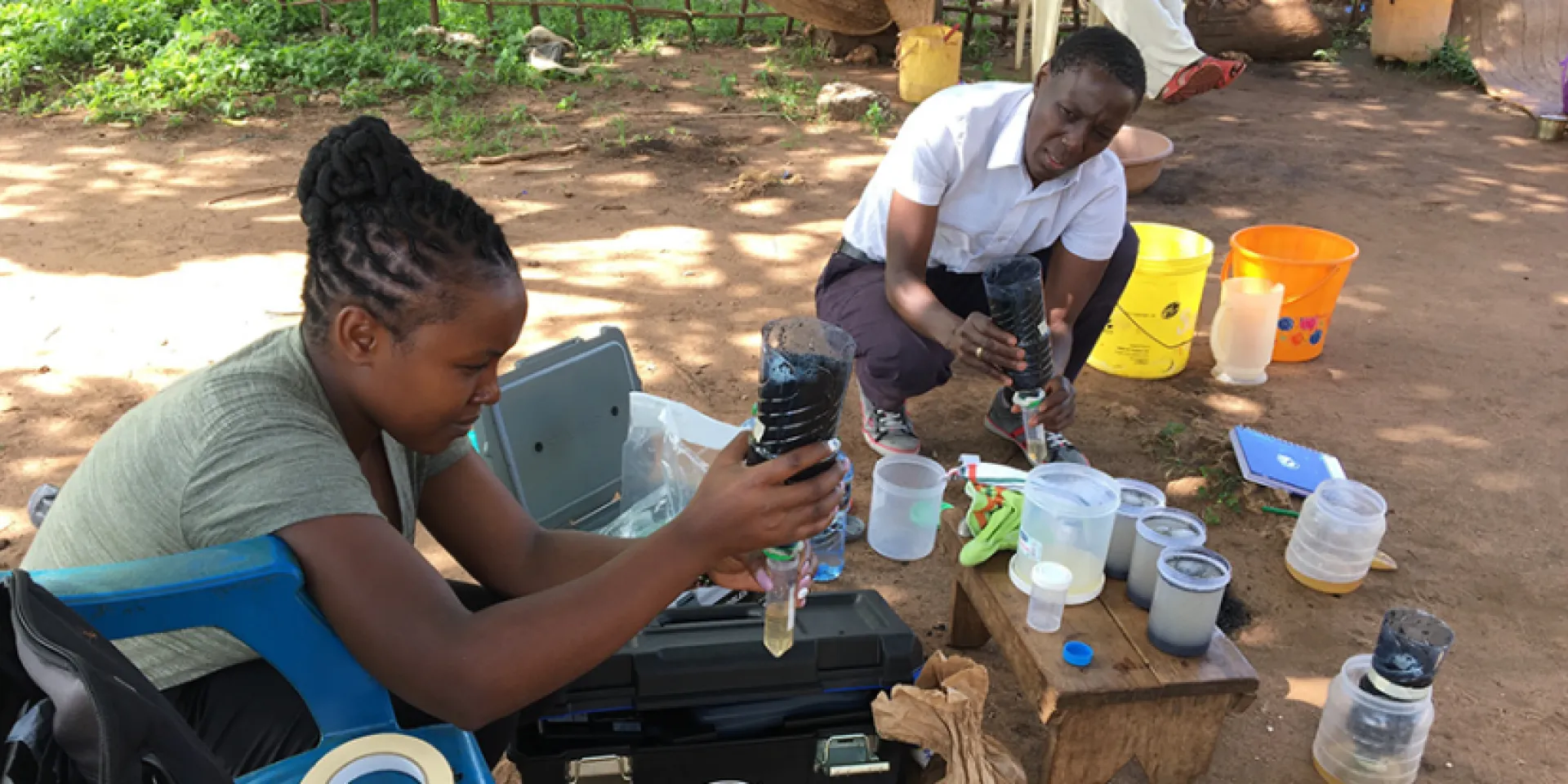 Dr Mary Njenga training MSC Student Catherine Ndinda Bonface in household greywater treatment using charcoal/biochar, in Kwale County, Kenya. 