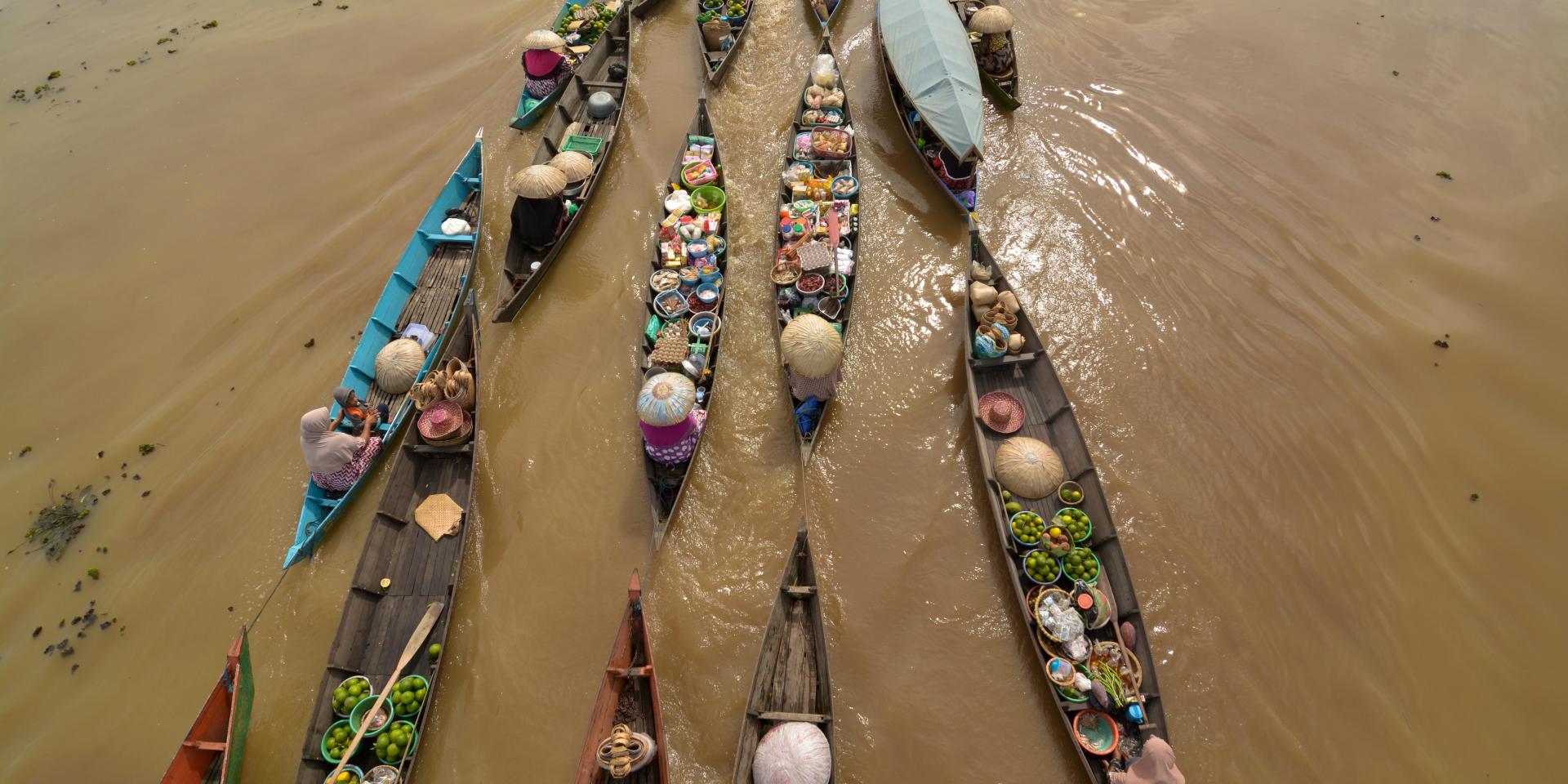 Merchants of Lok Baintan Floating Market on the Tabuk River, Indonesia