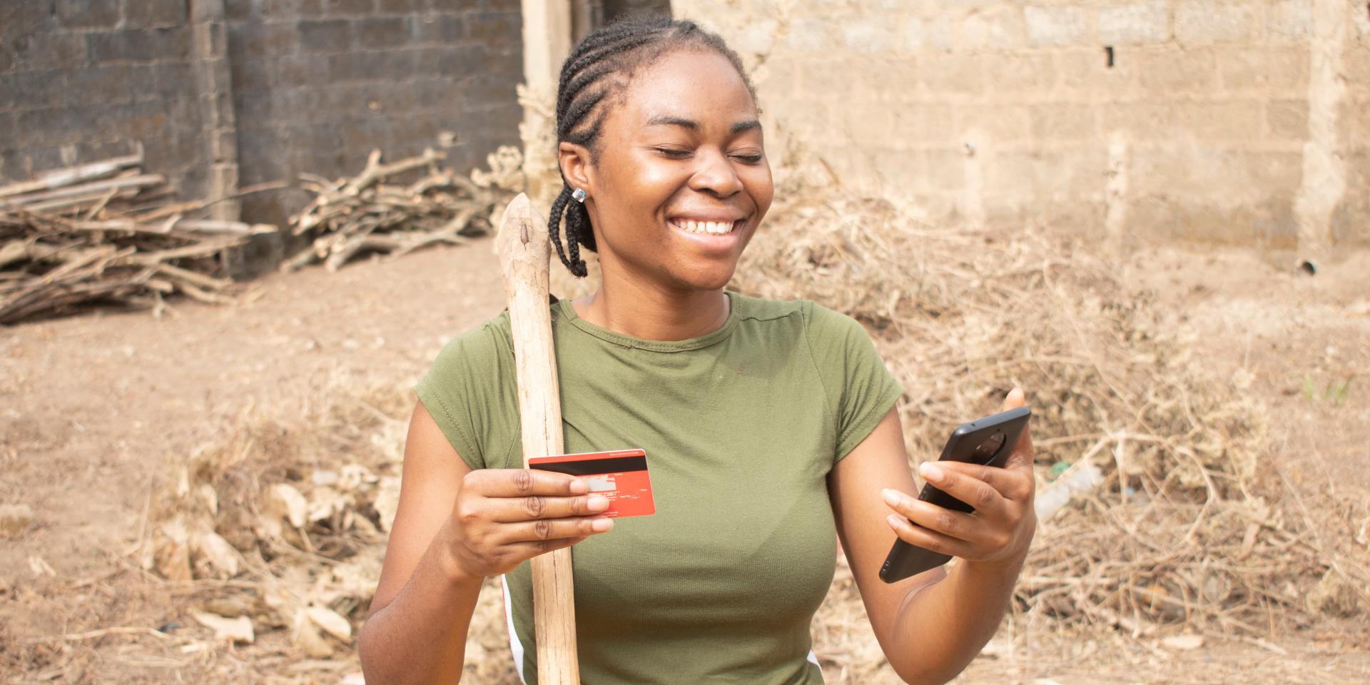 lady holding card and phone