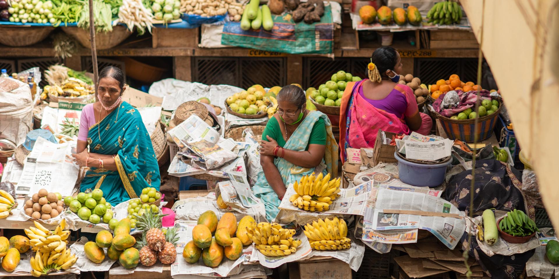 Fruit and vegetable vendors selling their product to locals, India