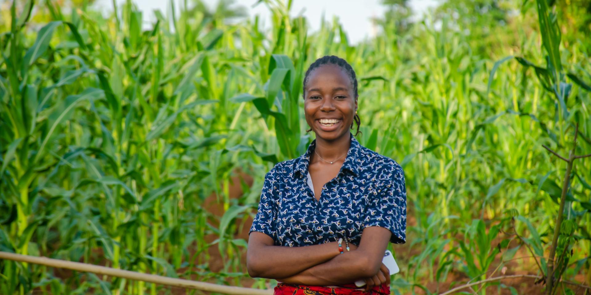 happy woman farmer in maize plantation