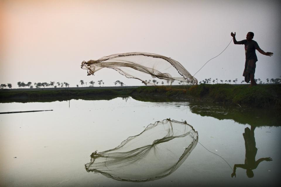 Someone throwing a fishing net