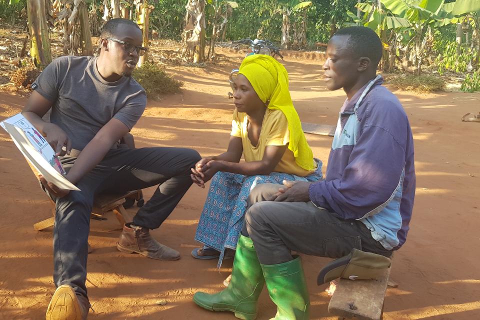 Enumerator administering the quantitative survey instrument with a couple (joint interview) in Kagera Region, Tanzania