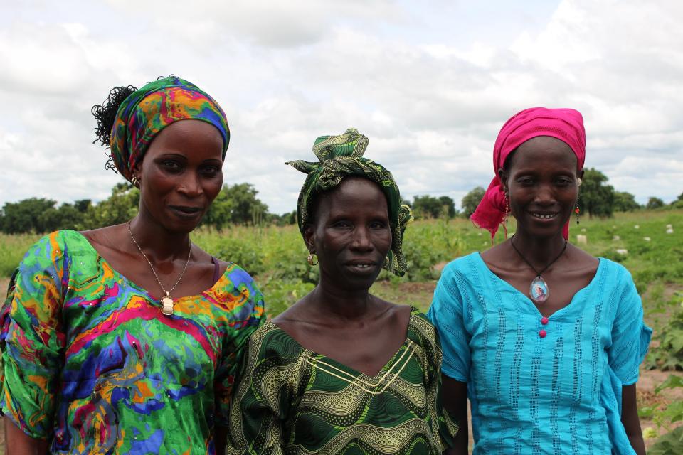 Ramatou Diouf (center) and her neighbours are part of of a women's farming group in Senegal that grow high-value crops for additional income. 