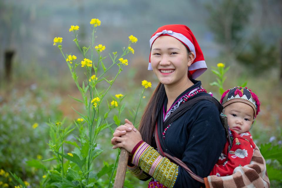Portrait of a Dao woman and her baby, Sa Pa, Lao Cai province, Vietnam.