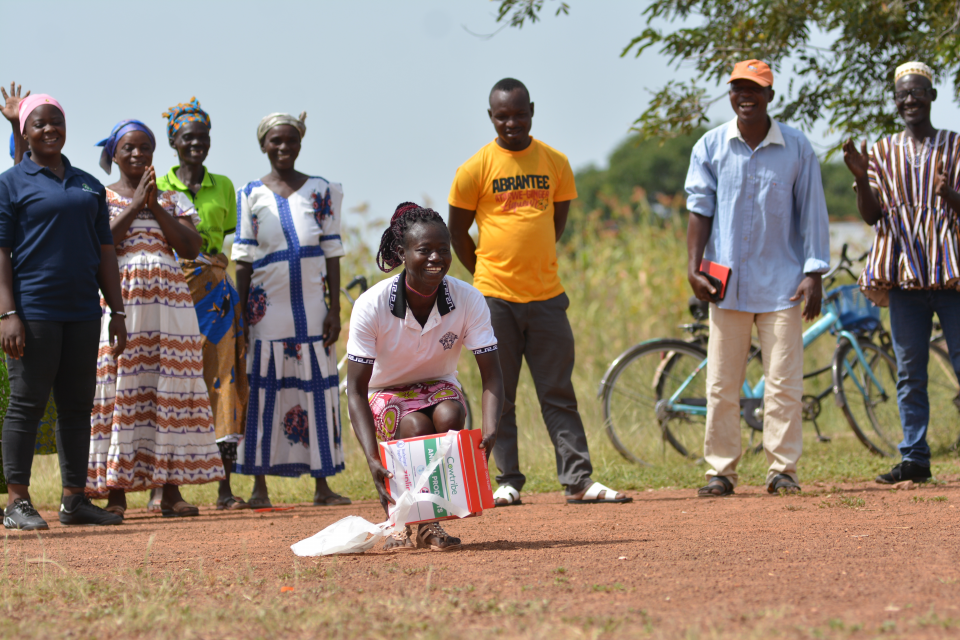 A woman receives a livestock vaccine via drone