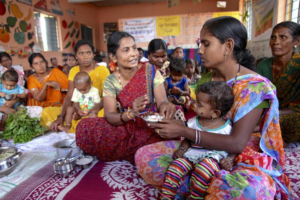 Women discuss food and nutrition during a meeting