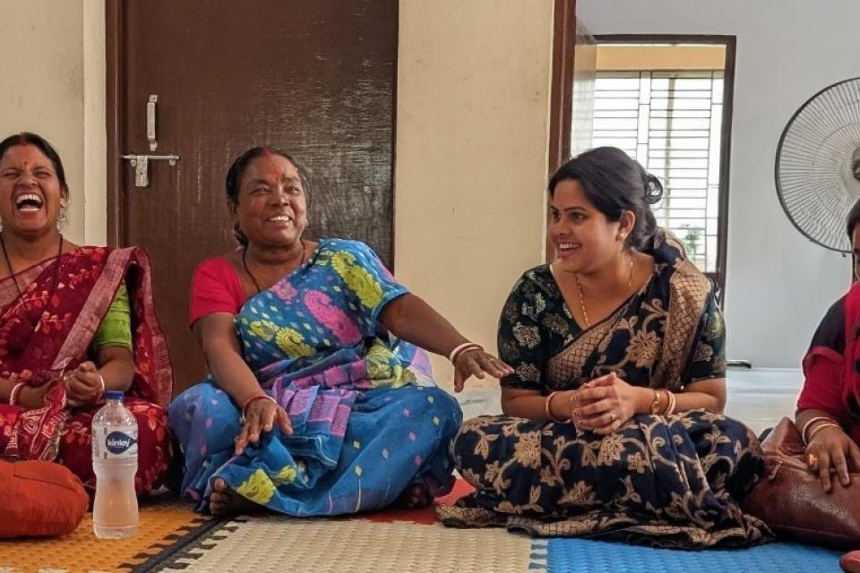 Women playing board game on the floor