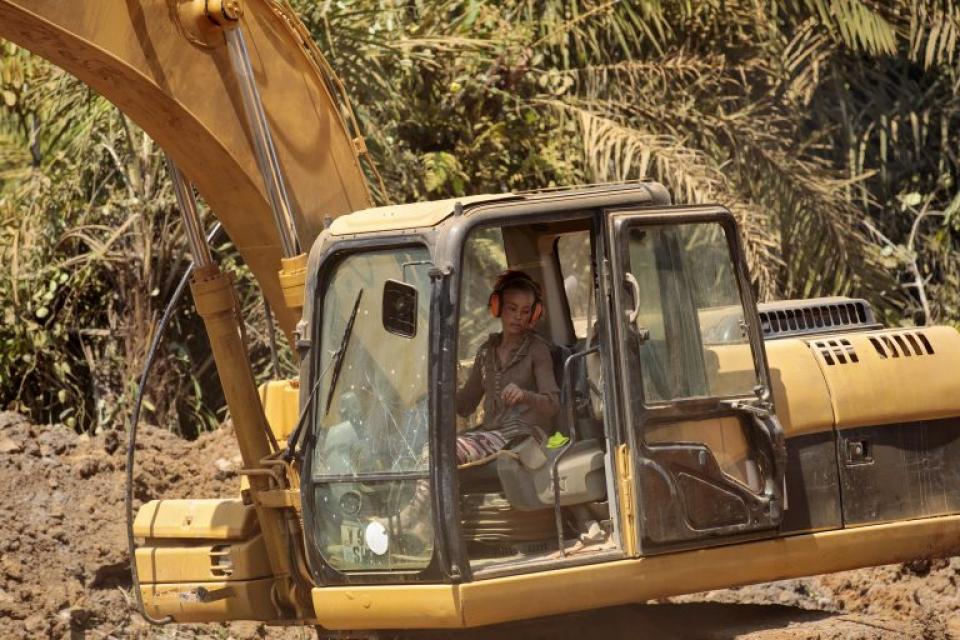Woman driving an excavator