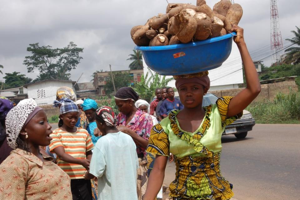 A woman carrying cassava