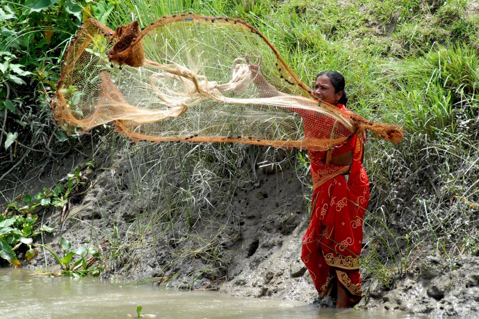 A woman setting a net