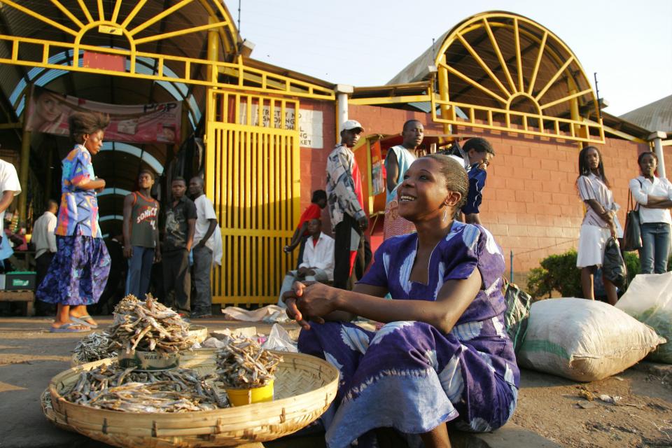 Woman selling fish in market, Zambia. Photo by Stevie Mann, 2007.