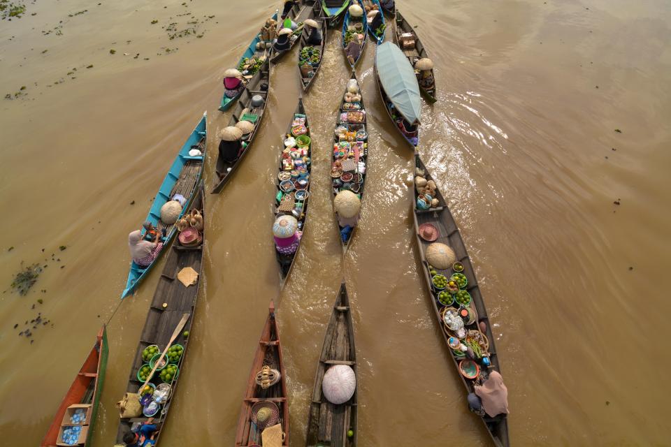 Merchants of Lok Baintan Floating Market on the Tabuk River, Indonesia