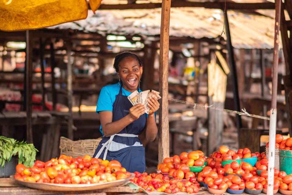 Woman farmer selling produce at the market